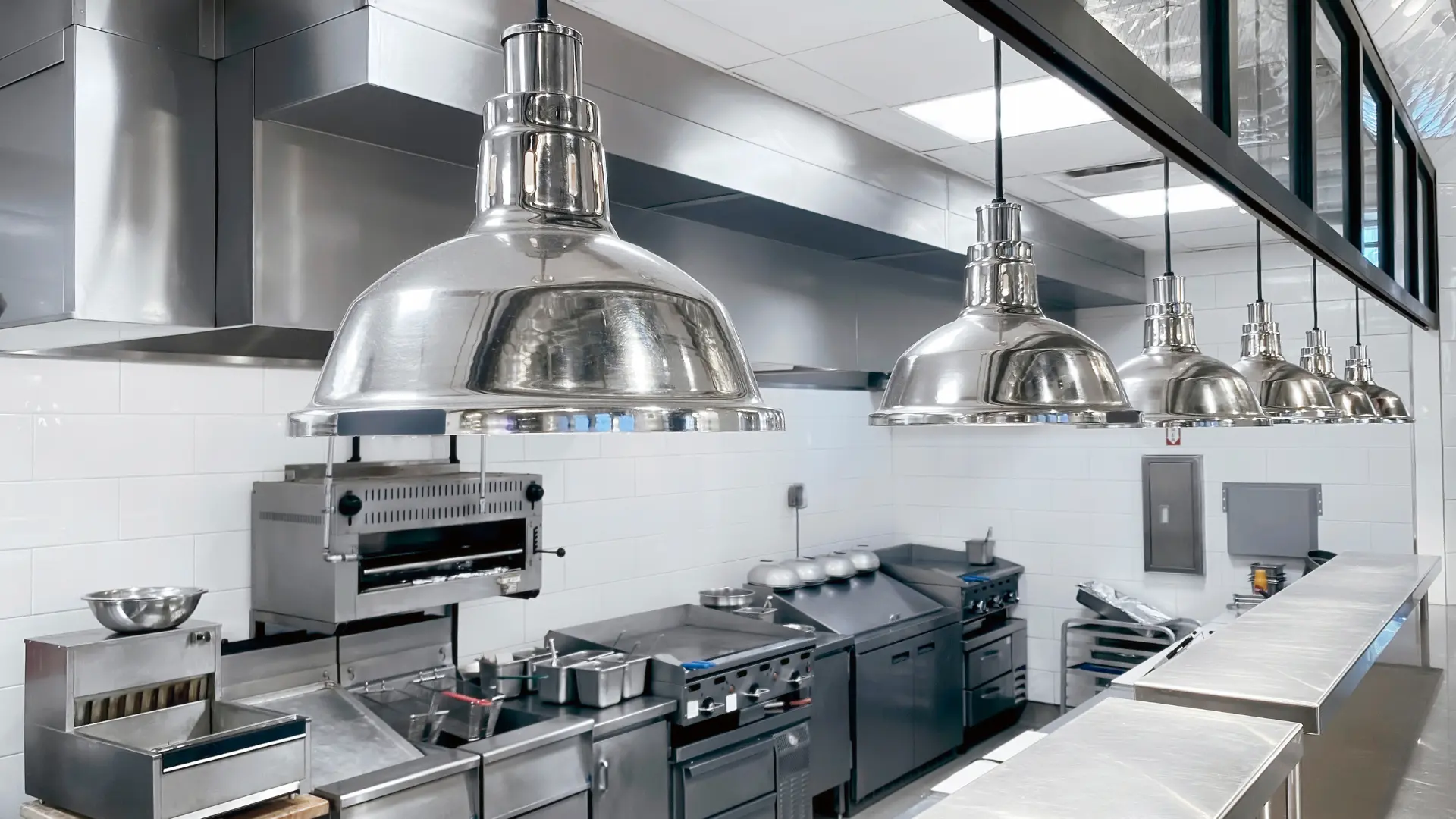 Commercial catering kitchen with gas appliances and extraction canopy
