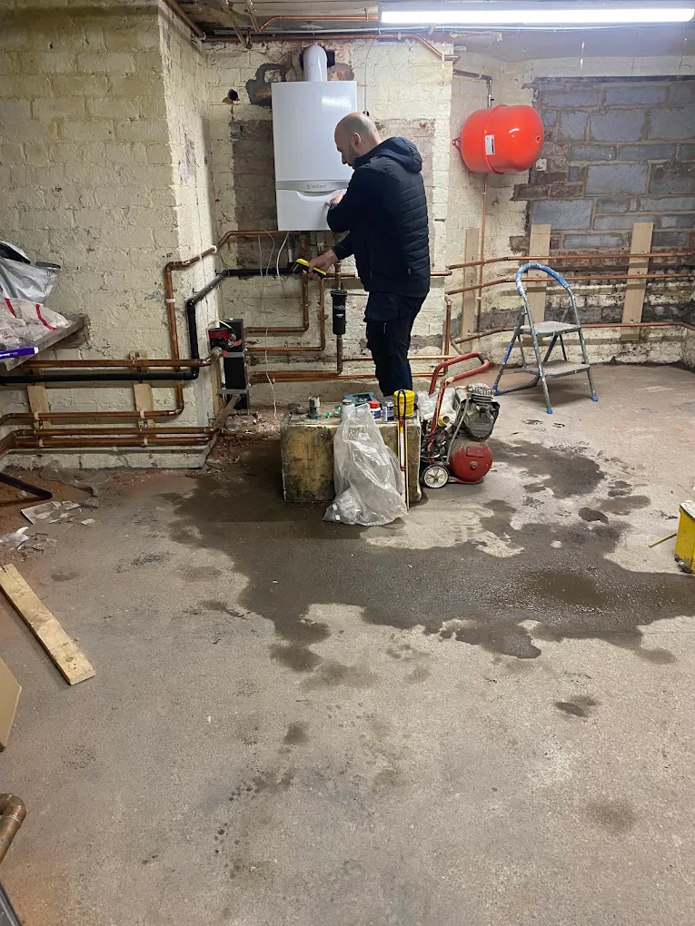 Vaillant boiler and copper pipework installed in a Liverpool cellar
